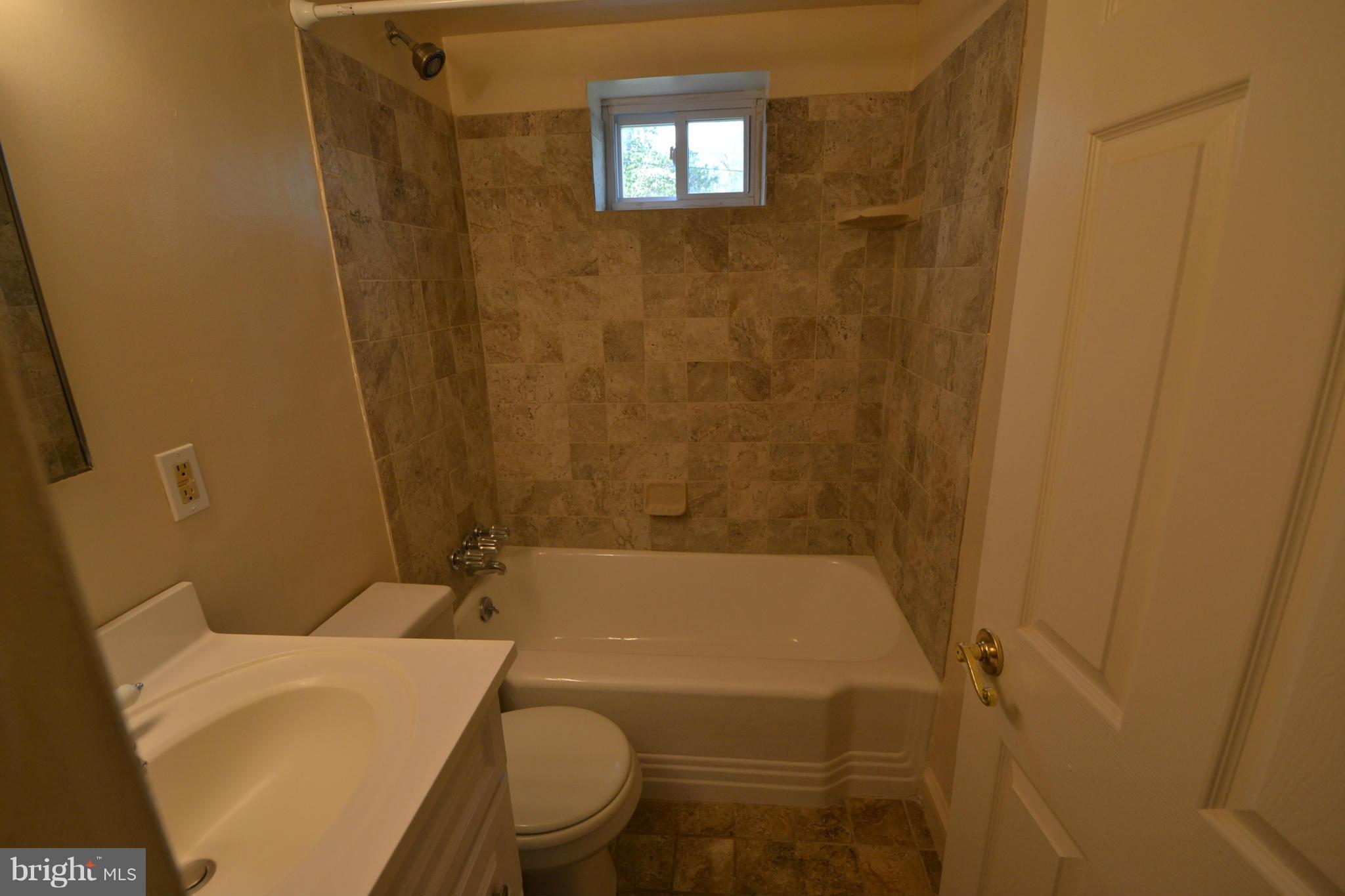 2504 Steele Road Baltimore, MD 21209 - Photo 14 of 21 a bathroom with a sink and a toilet