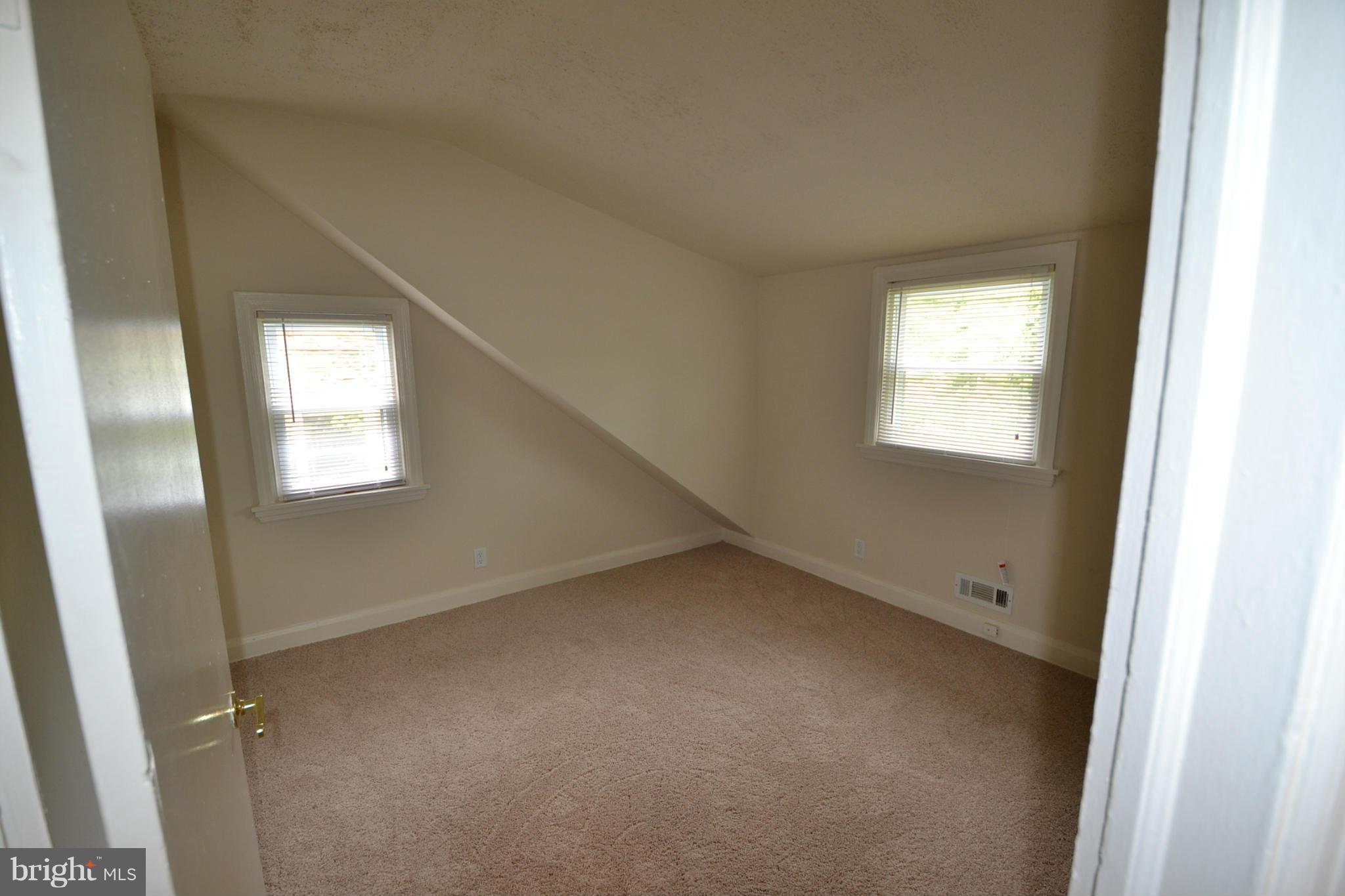 2504 Steele Road Baltimore, MD 21209 - Photo 16 of 21 a view of an empty room with a window