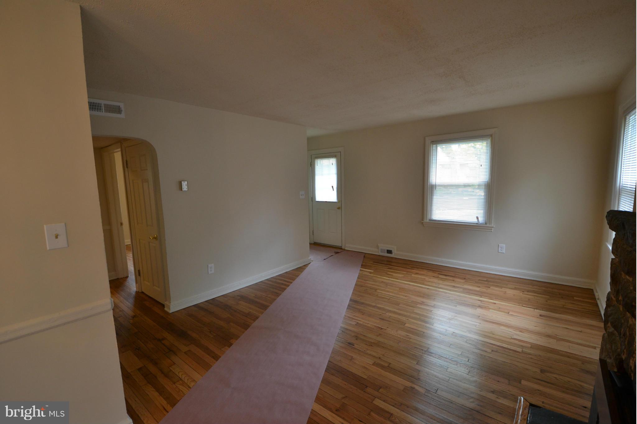 2504 Steele Road Baltimore, MD 21209 - Photo 5 of 21 a view of an empty room and window