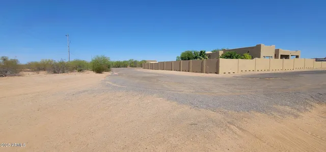 a view of a road with a building in the background