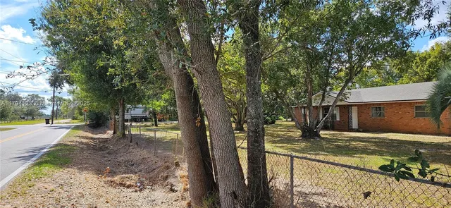 a view of a water with a yard