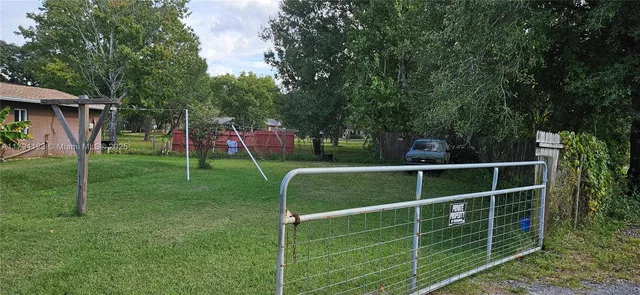 a kitchen with stainless steel appliances granite countertop a refrigerator and a stove