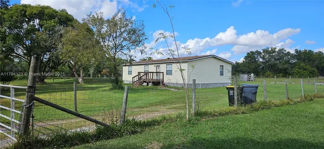 a view of hallway with wooden floor