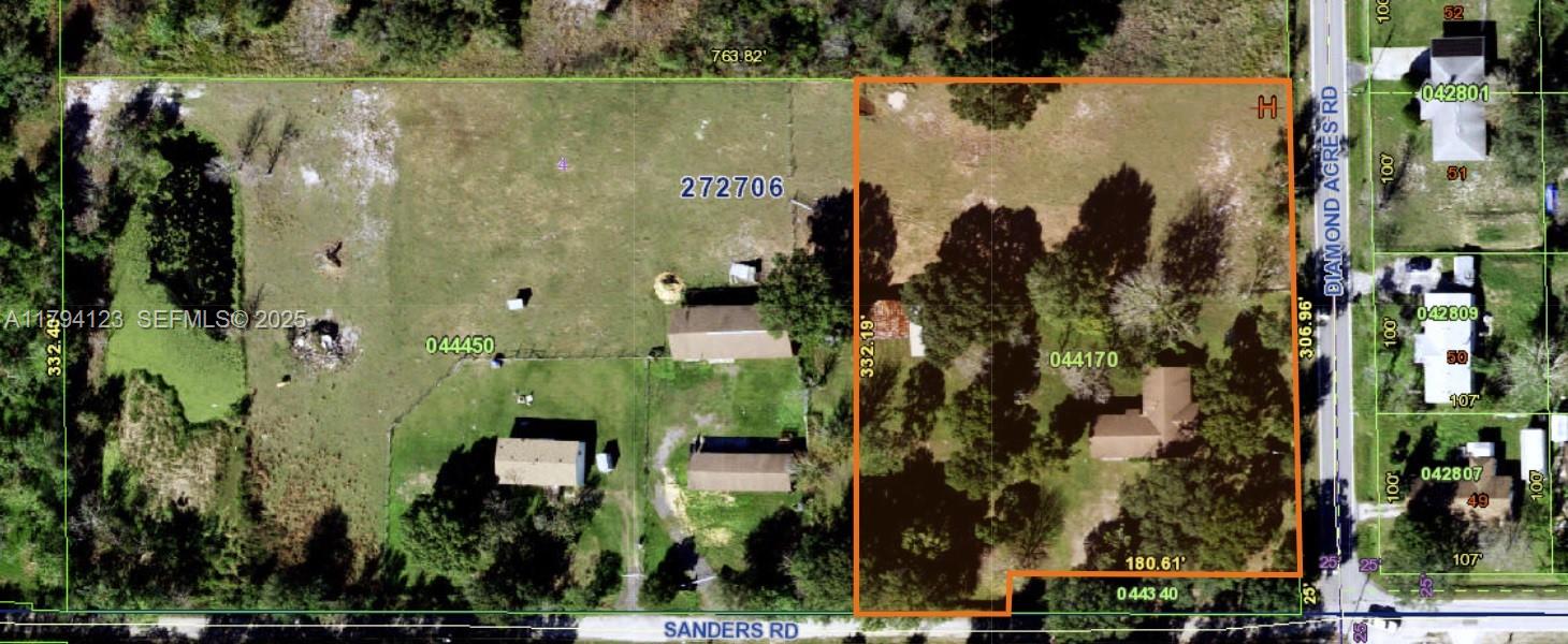 3100-3112 Sanders Road Davenport, FL 33837 - Photo 4 of 100 an aerial view of a residential apartment building with a yard and parking spaces