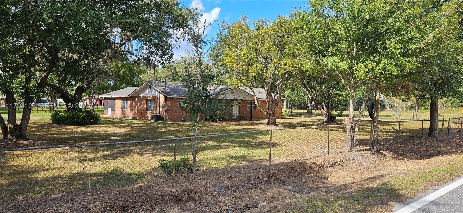 3100-3112 Sanders Road Davenport, FL 33837 - Photo 41 of 100 a view of a house with garden and trees