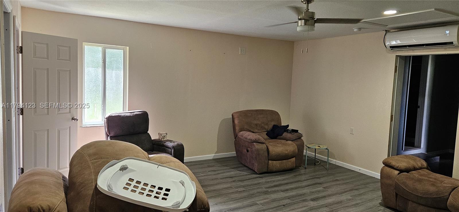 3100-3112 Sanders Road Davenport, FL 33837 - Photo 59 of 100 a living room with furniture and a window