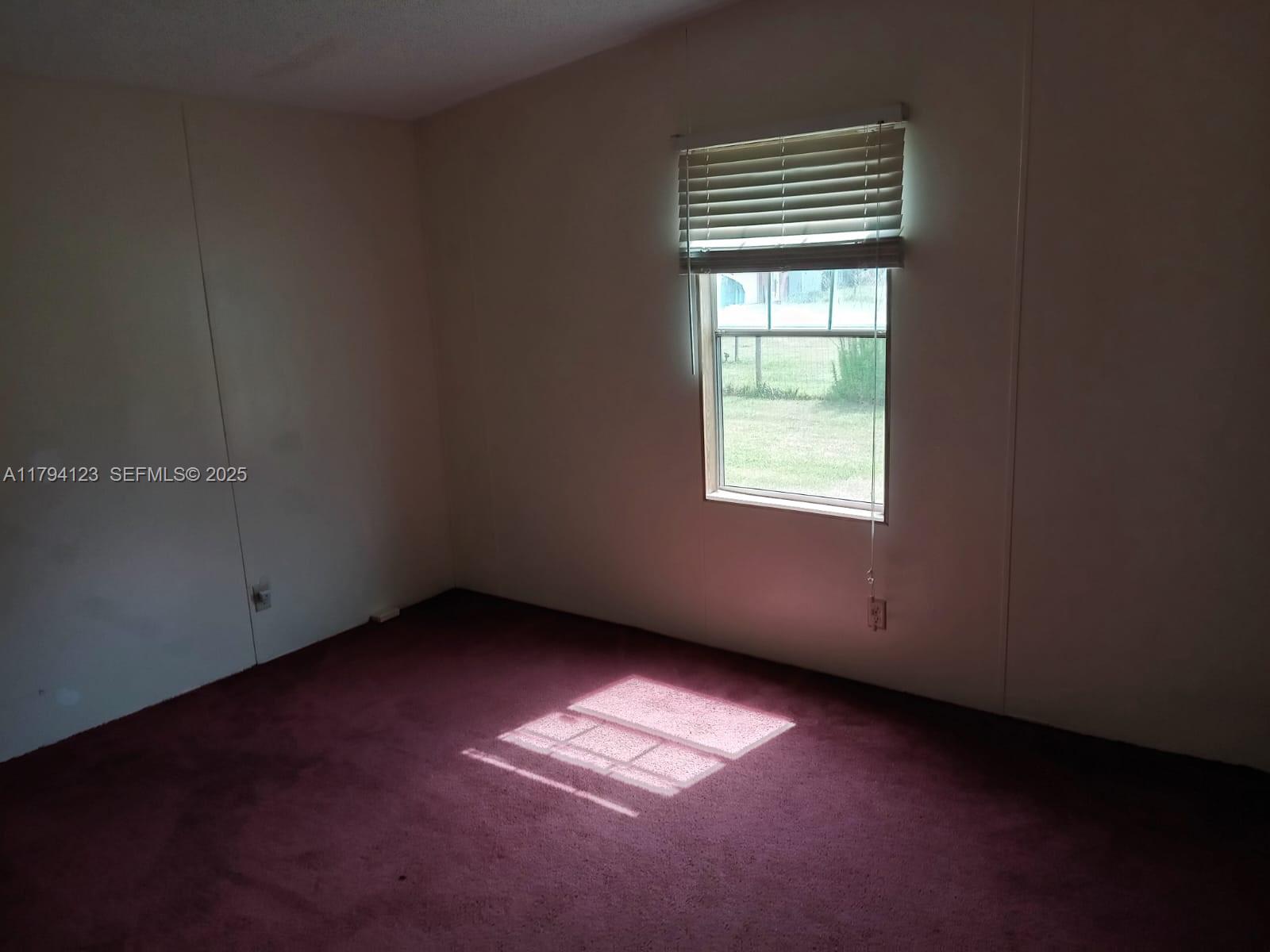 3100-3112 Sanders Road Davenport, FL 33837 - Photo 79 of 100 an empty room with a window