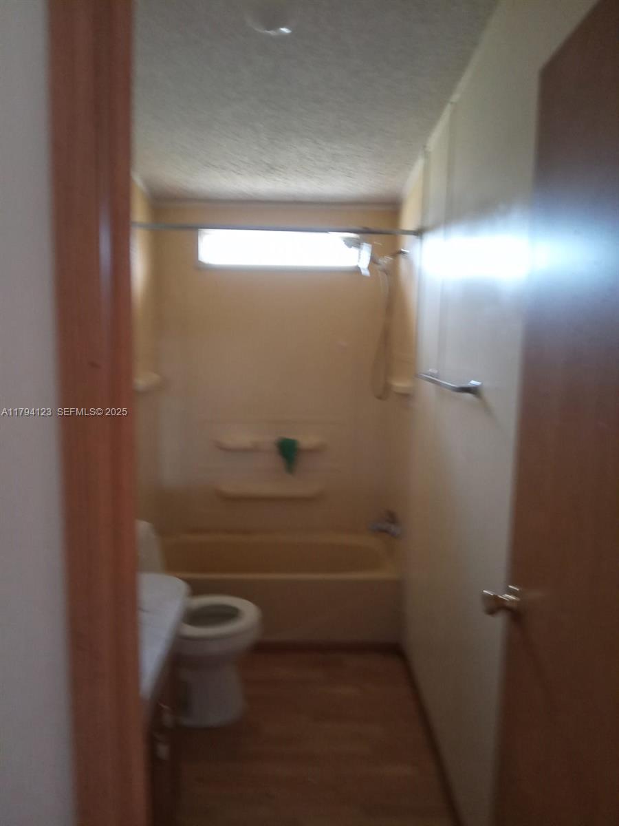 3100-3112 Sanders Road Davenport, FL 33837 - Photo 82 of 100 a bathroom with a shower