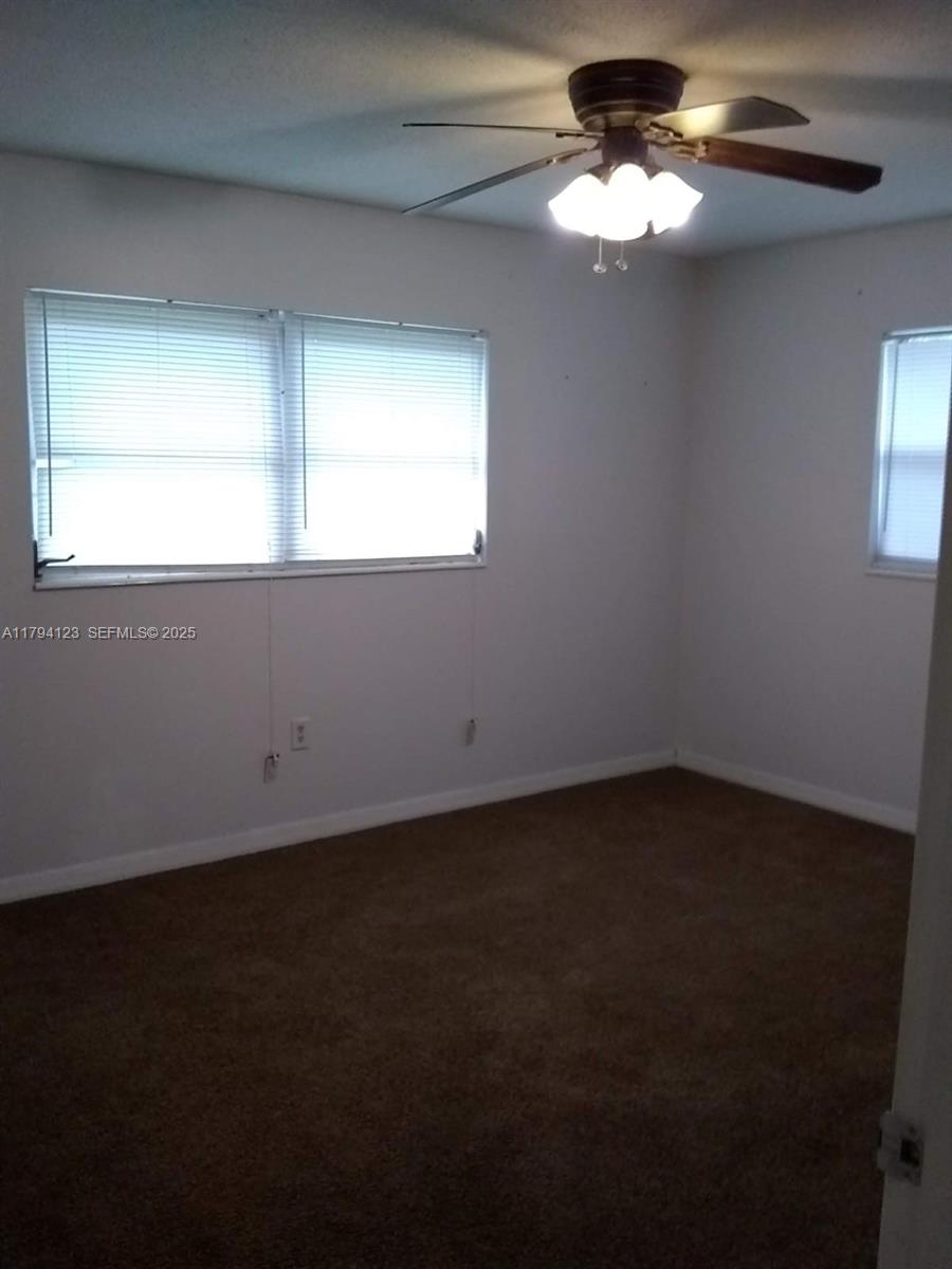 3100-3112 Sanders Road Davenport, FL 33837 - Photo 98 of 100 a view of an empty room with a window