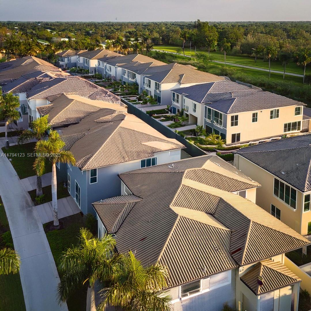 3100-3112 Sanders Road Davenport, FL 33837 - Photo 100 of 100 an aerial view of residential houses with outdoor space and parking