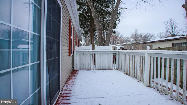 a view of a wooden fence and a pathway