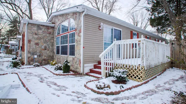 a view of a chair and table in backyard
