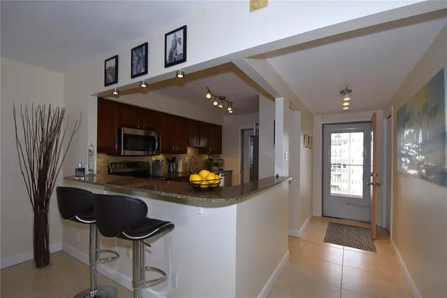 a view of a dining room with furniture and window