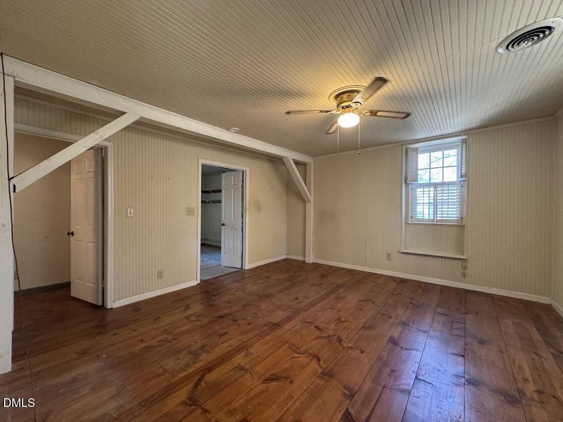 1134 Manchester Drive Cary, NC 27511 - Photo 15 of 15 a view of empty room with wooden floor and fan