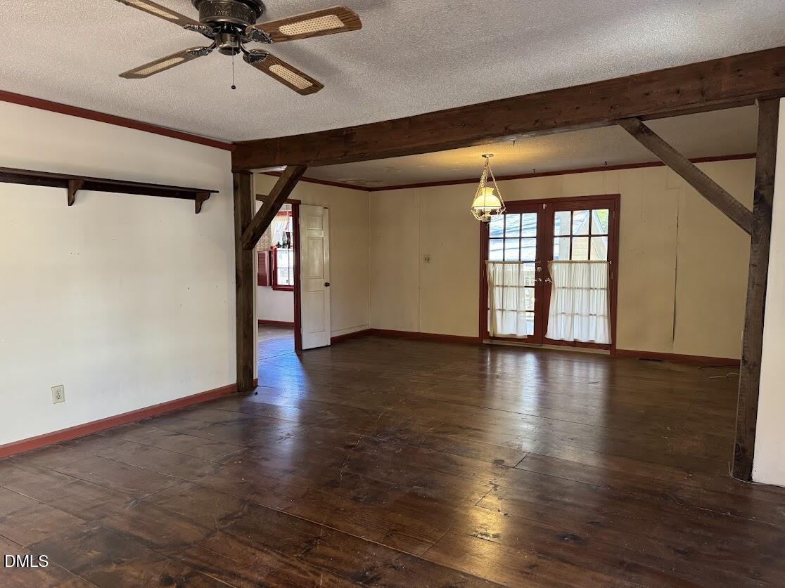 1134 Manchester Drive Cary, NC 27511 - Photo 6 of 15 a view of an empty room with wooden floor and a window