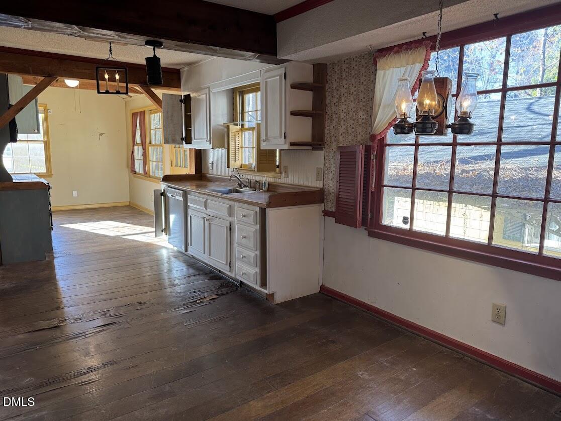 1134 Manchester Drive Cary, NC 27511 - Photo 10 of 15 a kitchen with stainless steel appliances granite countertop a stove and a wooden floors