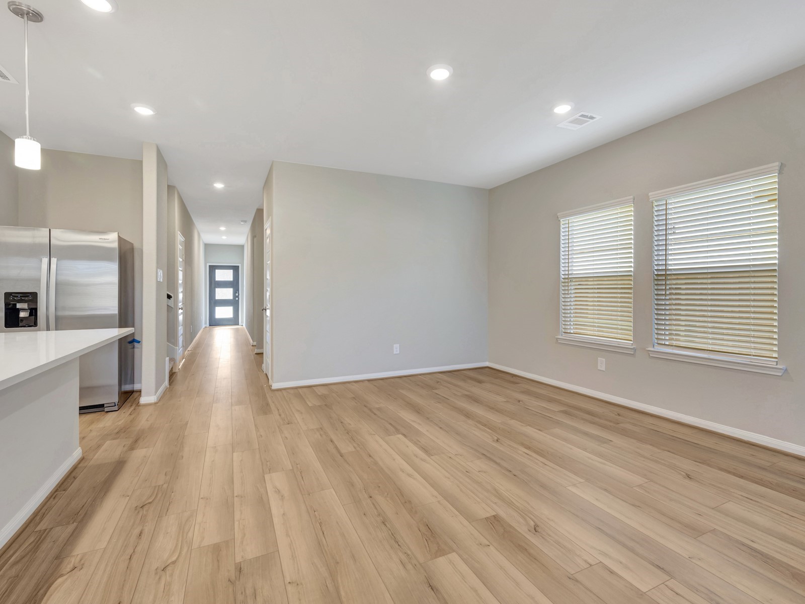17882 Stone Terrace Montgomery, TX 77316 - Photo 5 of 33 a view of an empty room with wooden floor and a window
