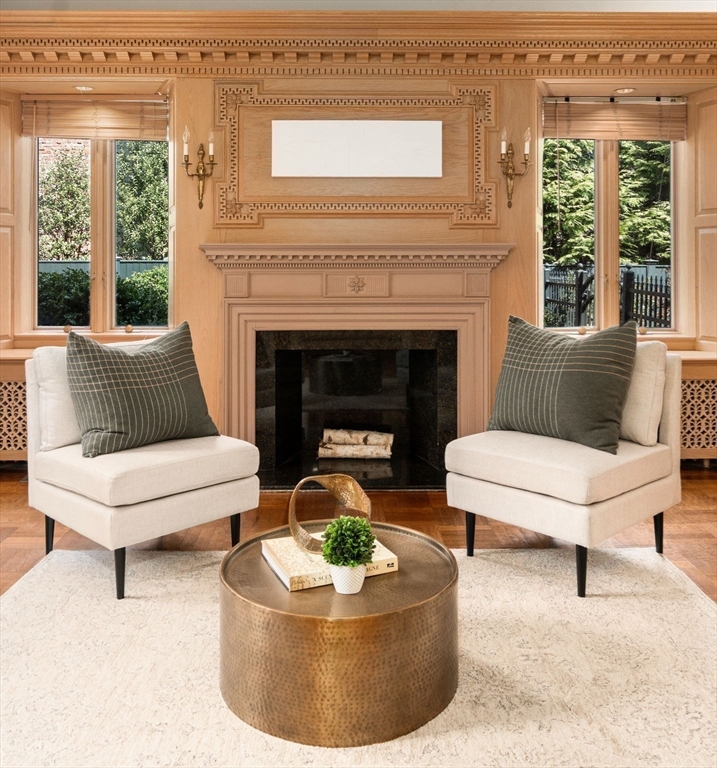 96 Monadnock Road Newton, MA 02467 - Photo 11 of 25 a living room with furniture a fireplace and a large window
