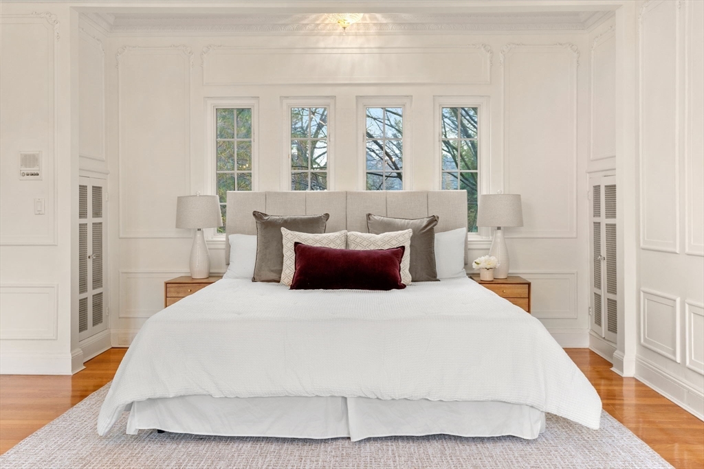 96 Monadnock Road Newton, MA 02467 - Photo 13 of 25 a bedroom with a large bed and a large window