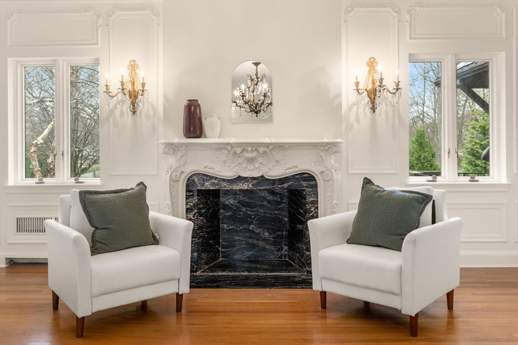 96 Monadnock Road Newton, MA 02467 - Photo 15 of 25 a living room with furniture and a fireplace