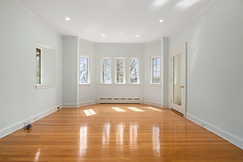 96 Monadnock Road Newton, MA 02467 - Photo 17 of 25 a view of a livingroom with wooden floor and a window