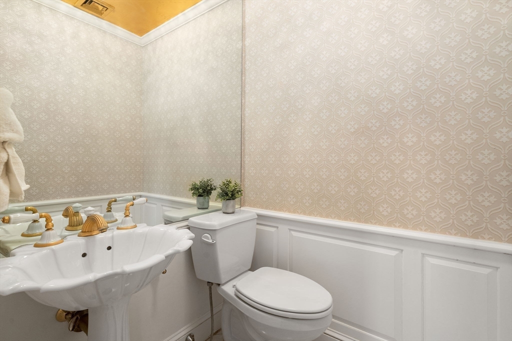 96 Monadnock Road Newton, MA 02467 - Photo 22 of 25 a bathroom with a sink a toilet and vanity