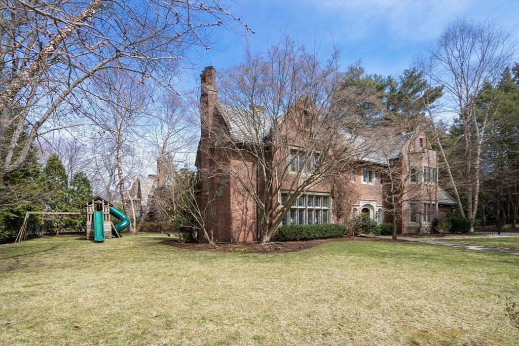 96 Monadnock Road Newton, MA 02467 - Photo 23 of 25 a view of a yard with a house and a tree