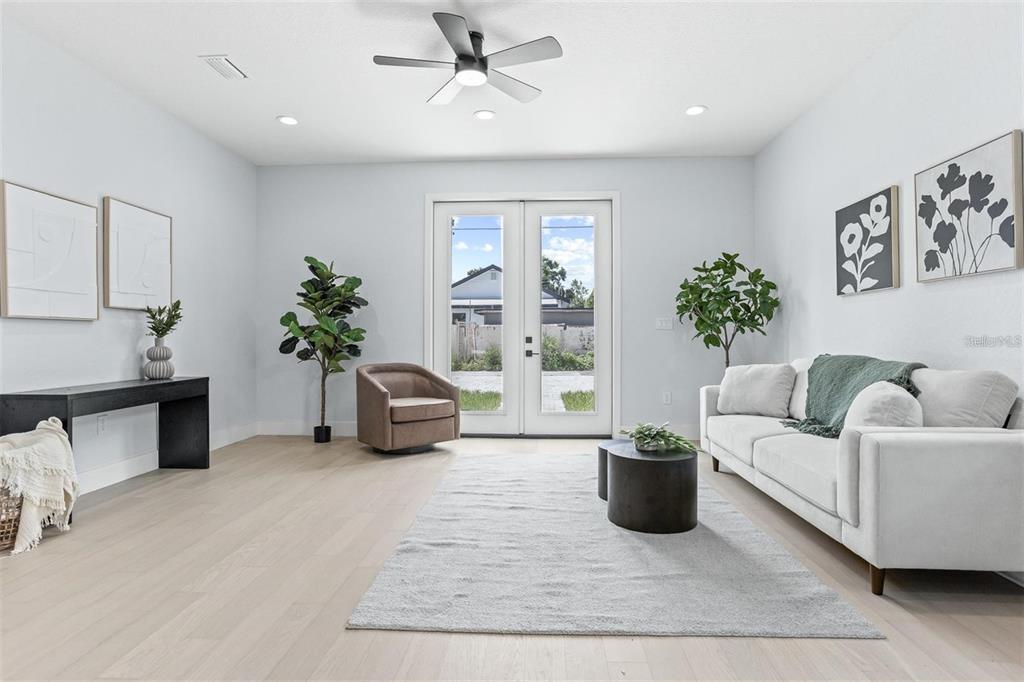 2512 West Chestnut Street Tampa, FL 33607 - Photo 2 of 11 a living room with furniture potted plant and window