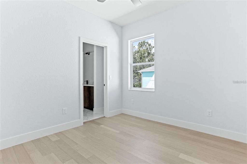 2512 West Chestnut Street Tampa, FL 33607 - Photo 9 of 11 an empty room with windows and closet