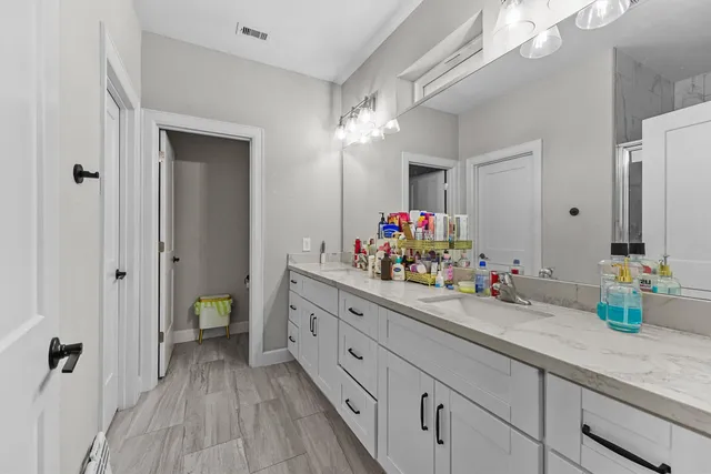 a kitchen with sink and cabinets