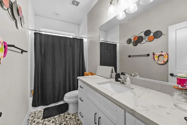 a bathroom with a sink a vanity and a mirror