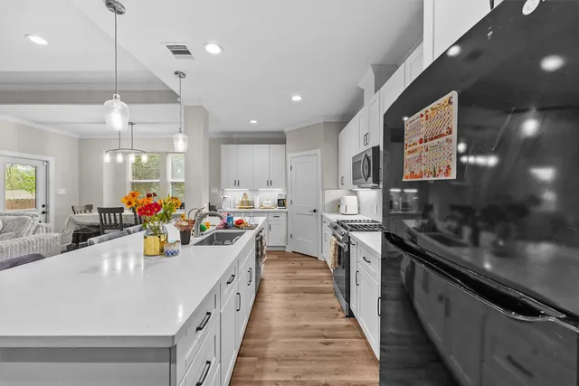 a kitchen with stainless steel appliances lots of counter top space