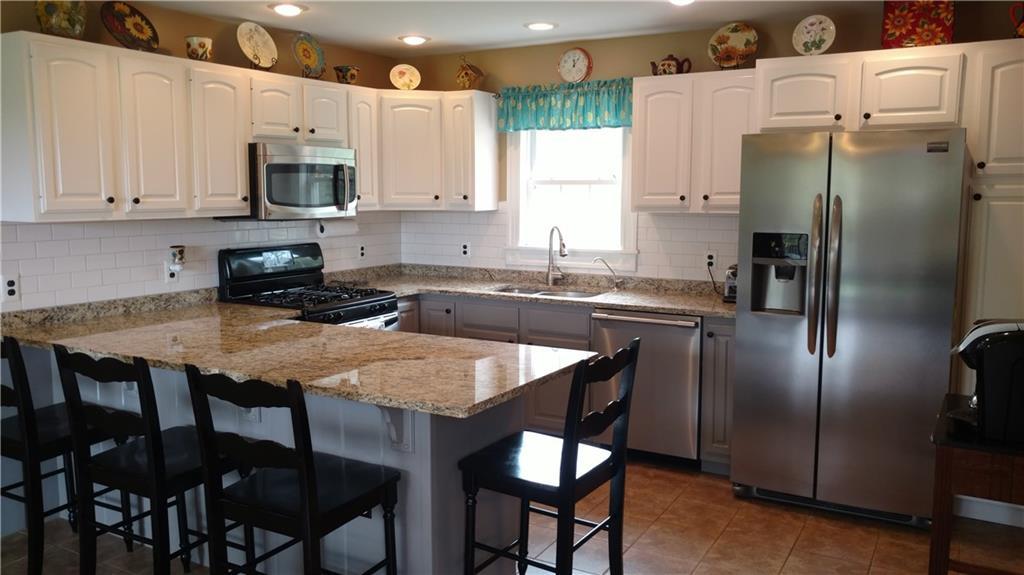 1304 Mercer Road Mercer, ME 04957 - Photo 6 of 30 Granite counters and tile...