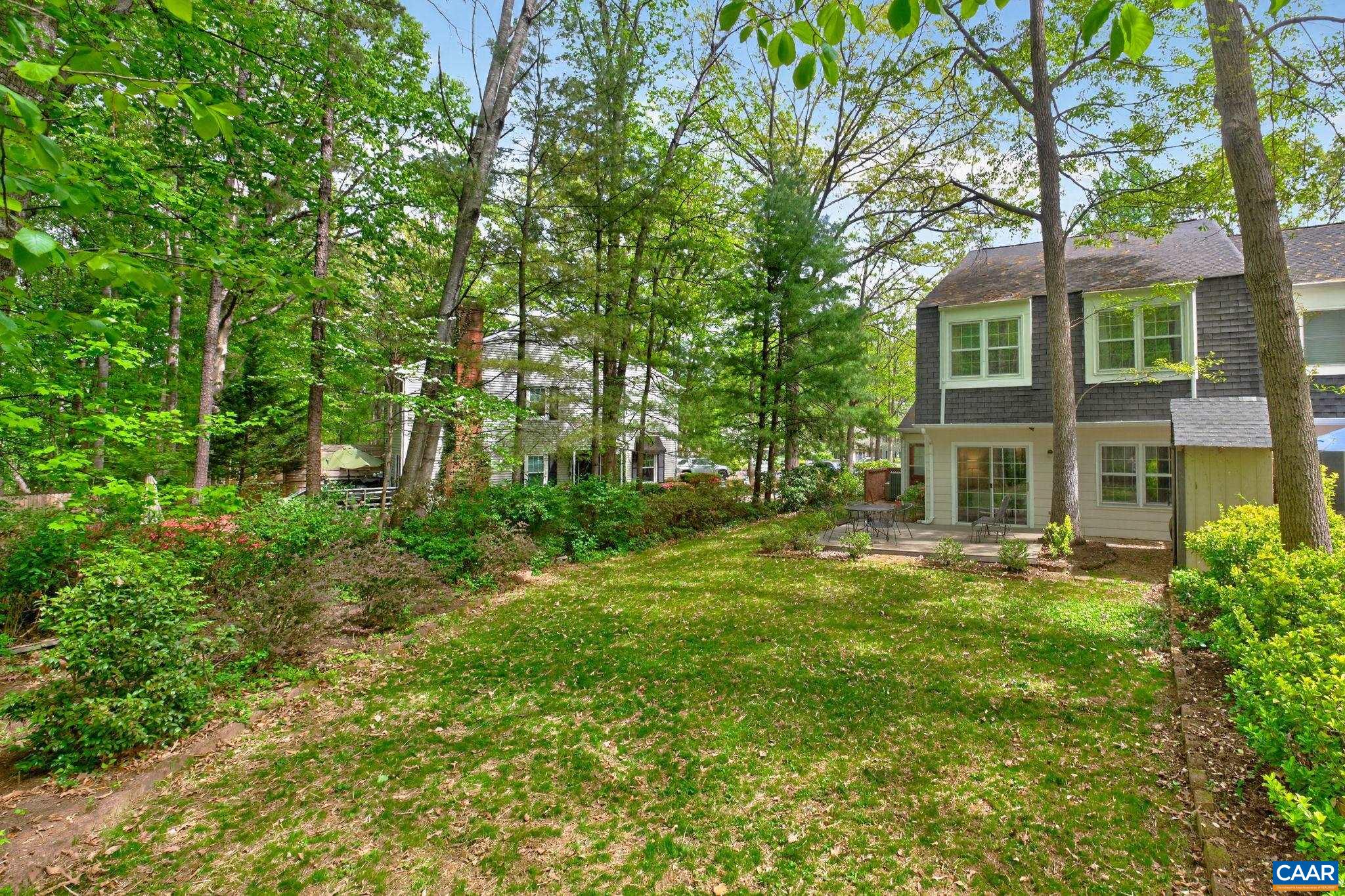 326 Westfield Road Charlottesville, VA 22901 - Photo 31 of 36 a view of a big yard in front of a brick house with large windows