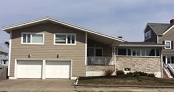 a front view of a house with a garage