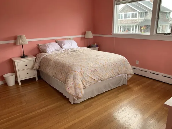 a bed room with a bed and a night stand