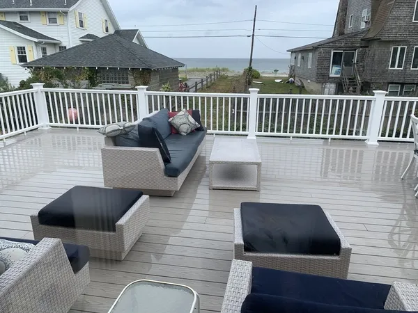 a balcony with wooden floor