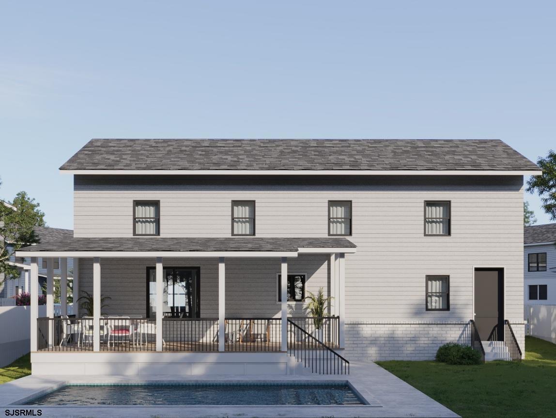 604 9th Street Somers Point, NJ 08244 - Photo 2 of 6 a front view of a house with garden