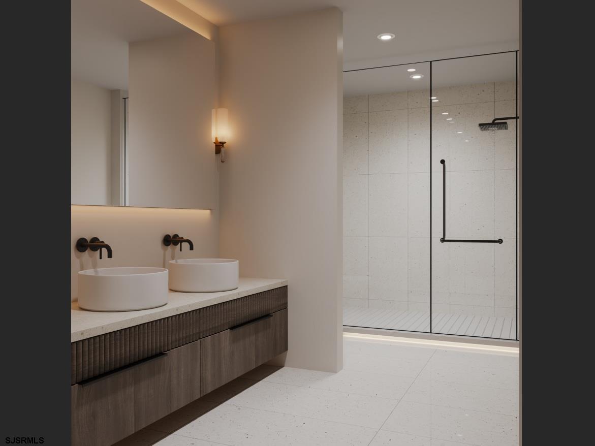 604 9th Street Somers Point, NJ 08244 - Photo 6 of 6 a bathroom with a sink and a mirror