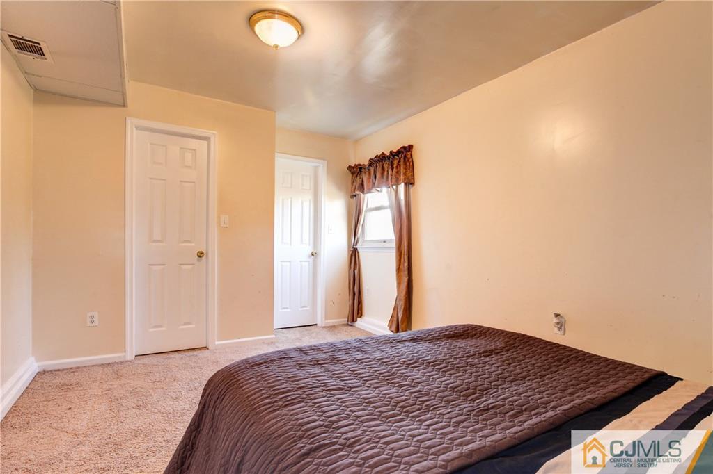 4 Laythan Road Edison, NJ 08817 - Photo 14 of 25 a bedroom with a bed and a dresser