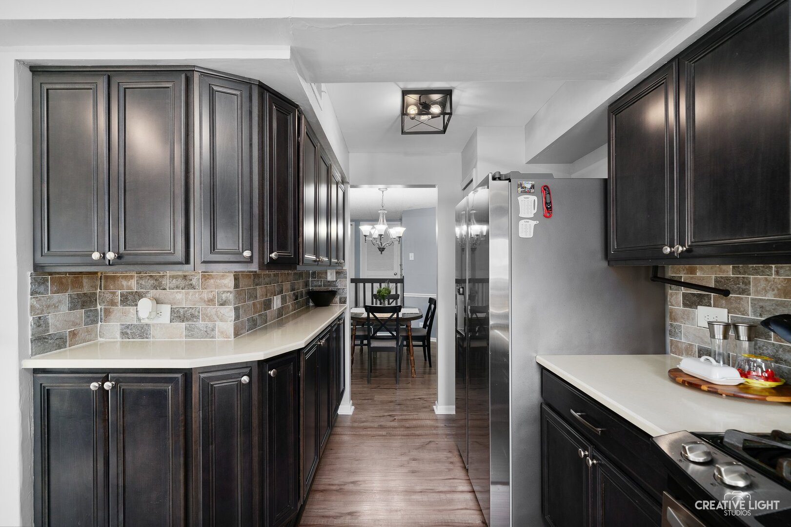 1258 Chalet Road, Unit 104 Naperville, IL 60563 - Photo 3 of 14 a kitchen with granite countertop cabinets and stainless steel appliances