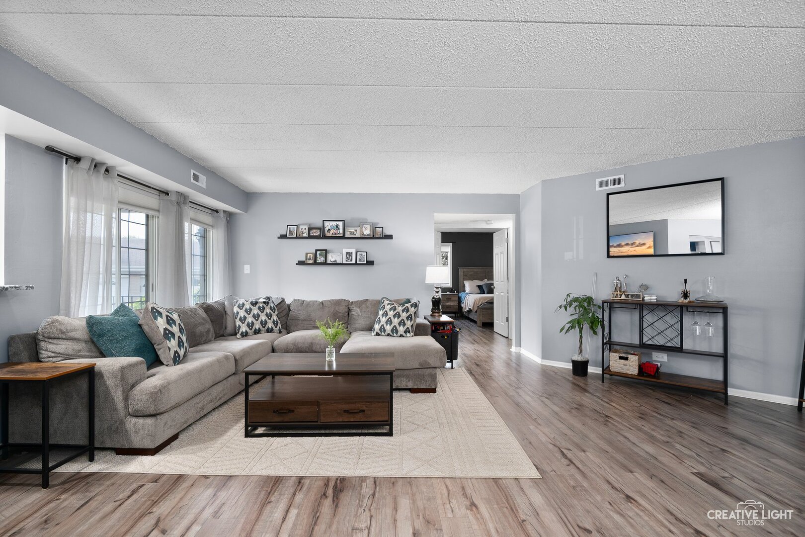 1258 Chalet Road, Unit 104 Naperville, IL 60563 - Photo 6 of 14 a living room with furniture and wooden floor