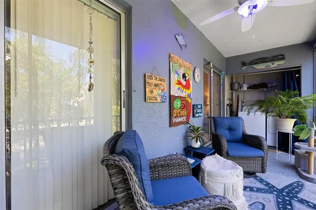 a living room with furniture and flowers