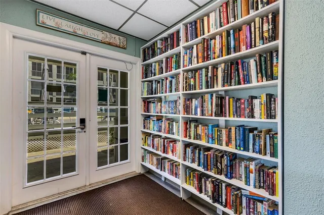 a view of room with lots of shelves