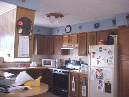 2461 Graham Road Belvidere, IL 61008 - Photo 3 of 6 a kitchen with a refrigerator and a stove top oven