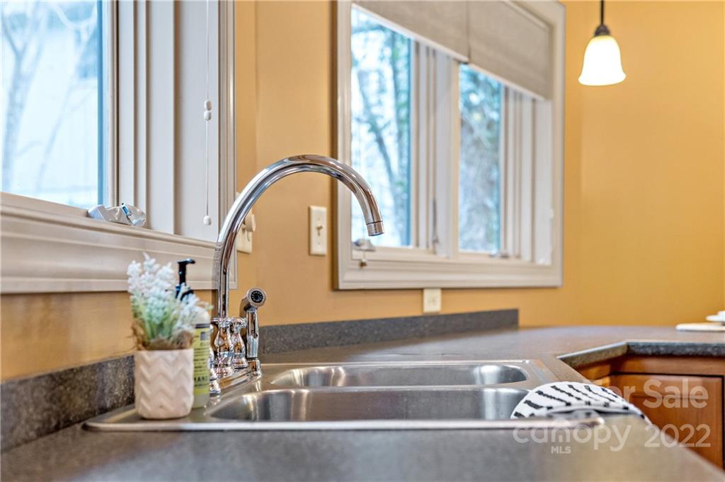 174 A Weston Road Arden, NC 28704 - Photo 12 of 31 a bathroom with a tub sink and a mirror
