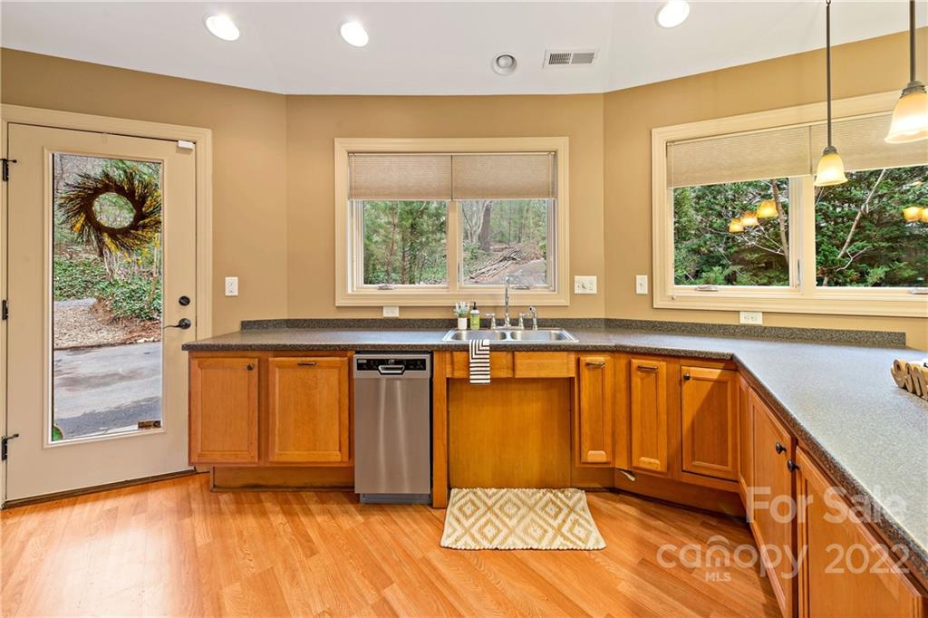 174 A Weston Road Arden, NC 28704 - Photo 13 of 31 a view of a kitchen with wooden floor and a window