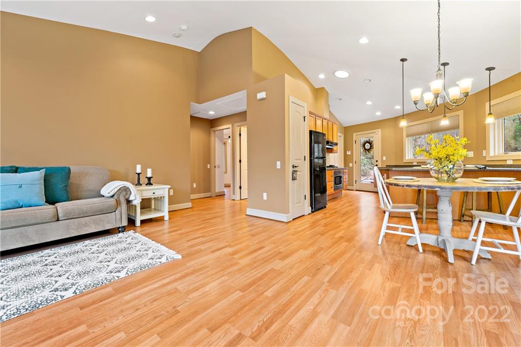 174 A Weston Road Arden, NC 28704 - Photo 15 of 31 a living room with furniture and a wooden floor