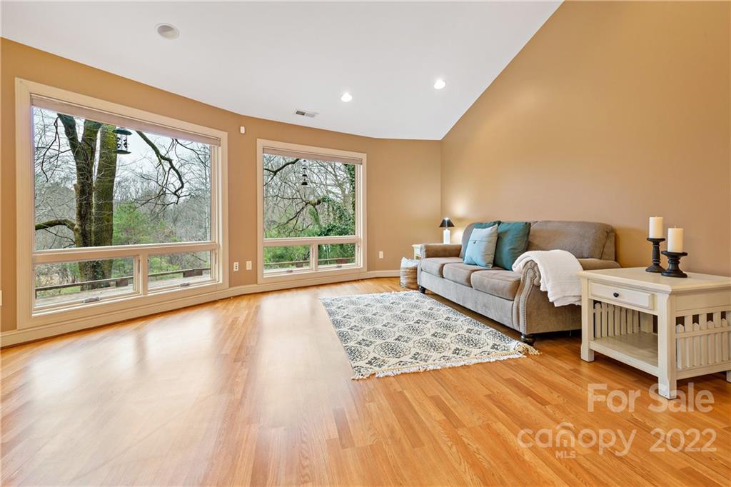 174 A Weston Road Arden, NC 28704 - Photo 17 of 31 a bedroom with furniture and a large window