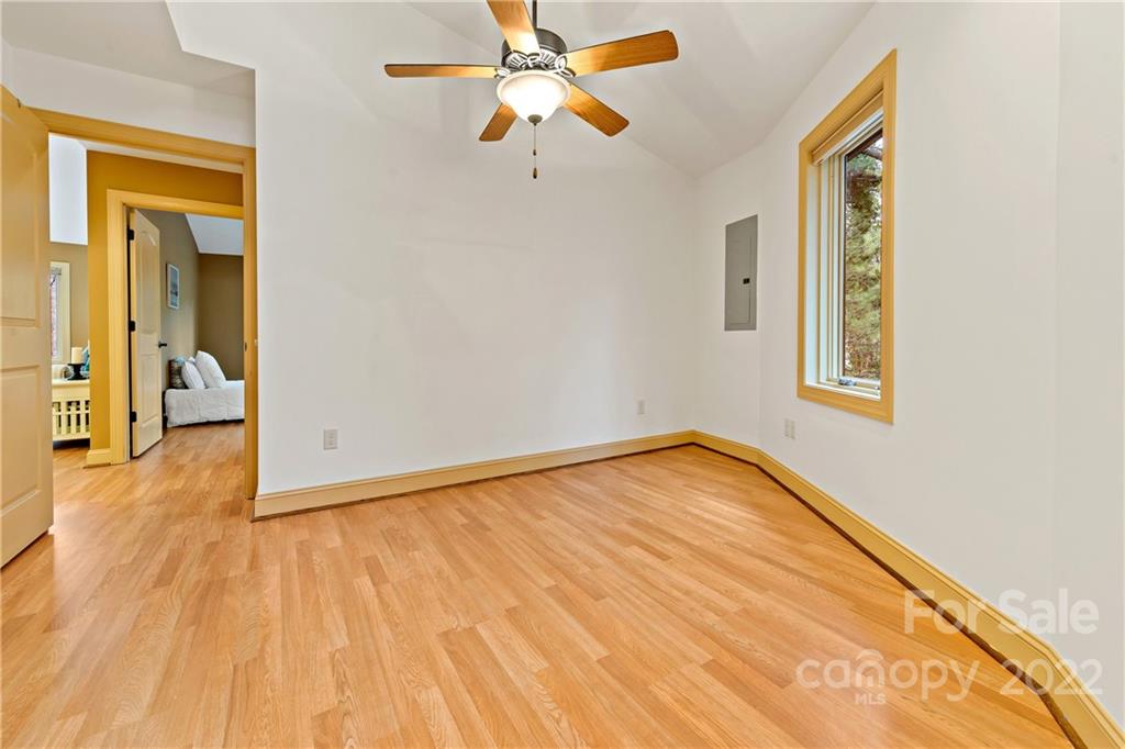 174 A Weston Road Arden, NC 28704 - Photo 26 of 31 a view of an empty room with wooden floor